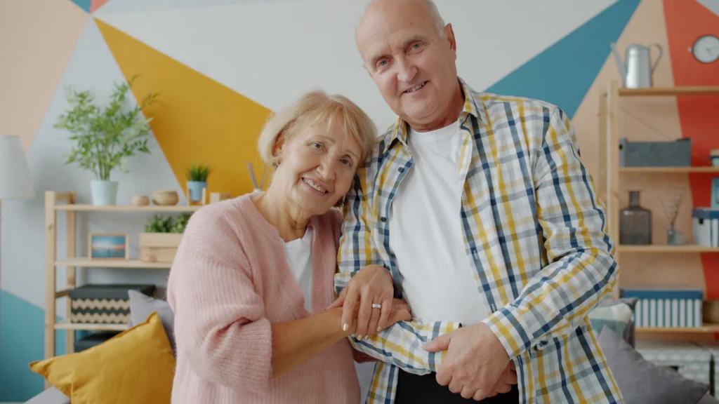 Senior couple smiling at home