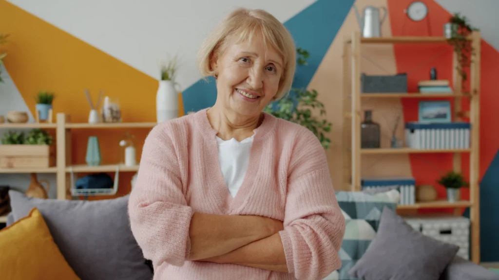 Senior woman smiling with arms crossed