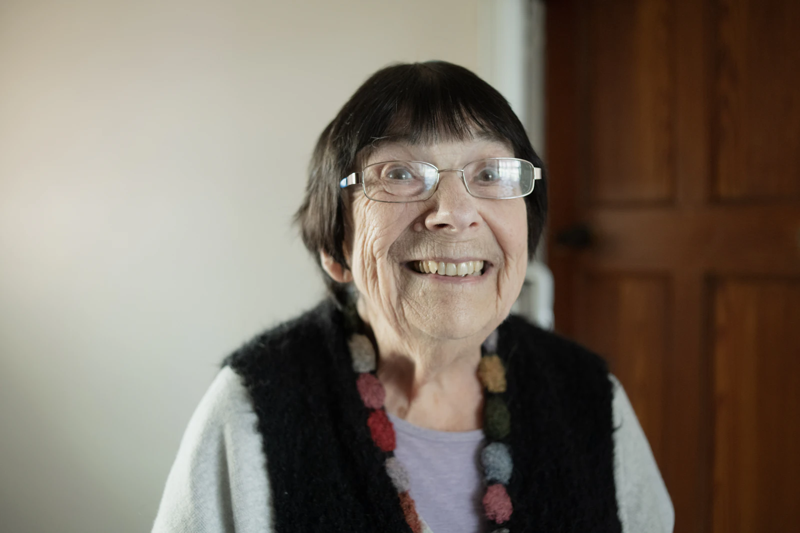 Senior woman with glasses smiling
