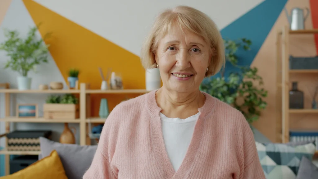 Smiling senior woman in a bright living room