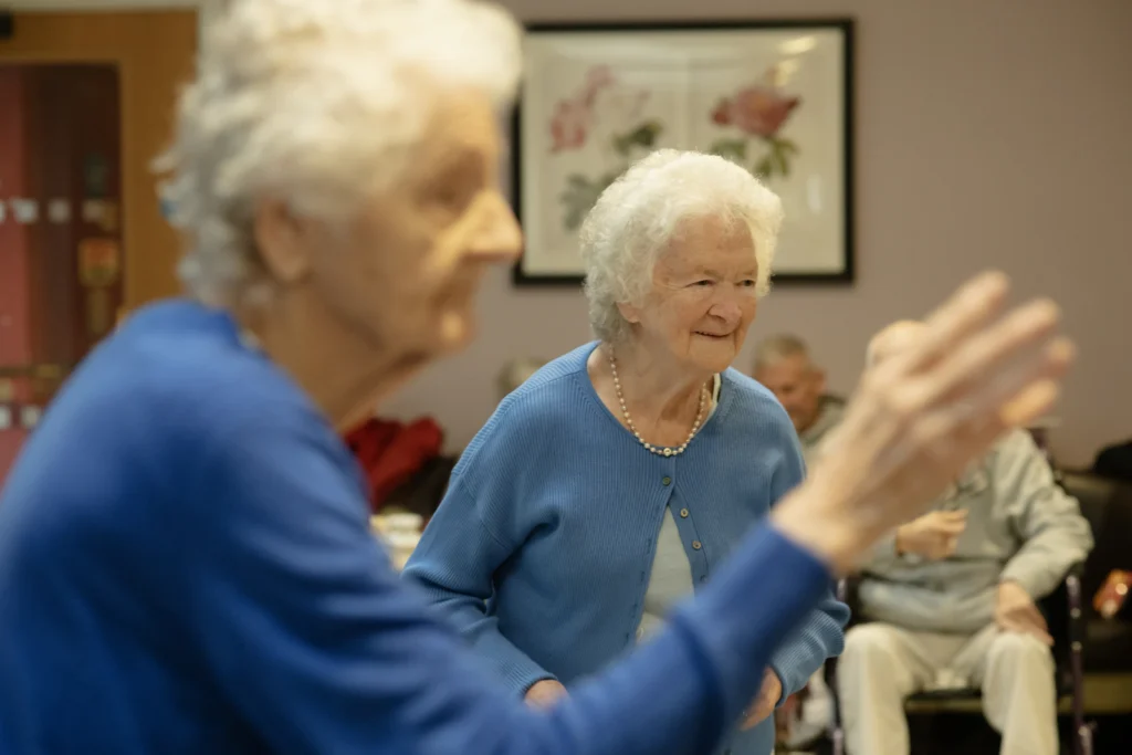 Senior residents chatting at a table